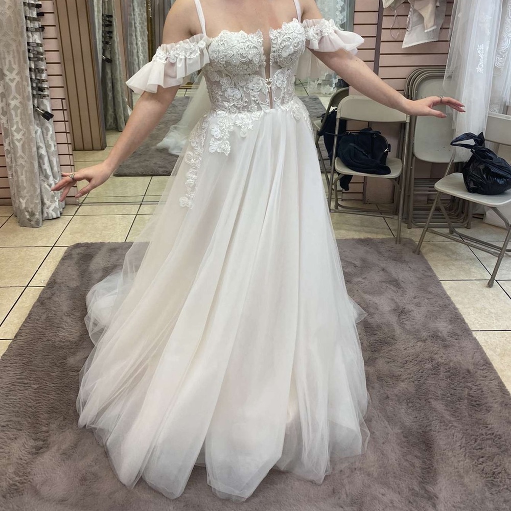 White floor length gown with cold shoulder sleeves and a train 
Size 6